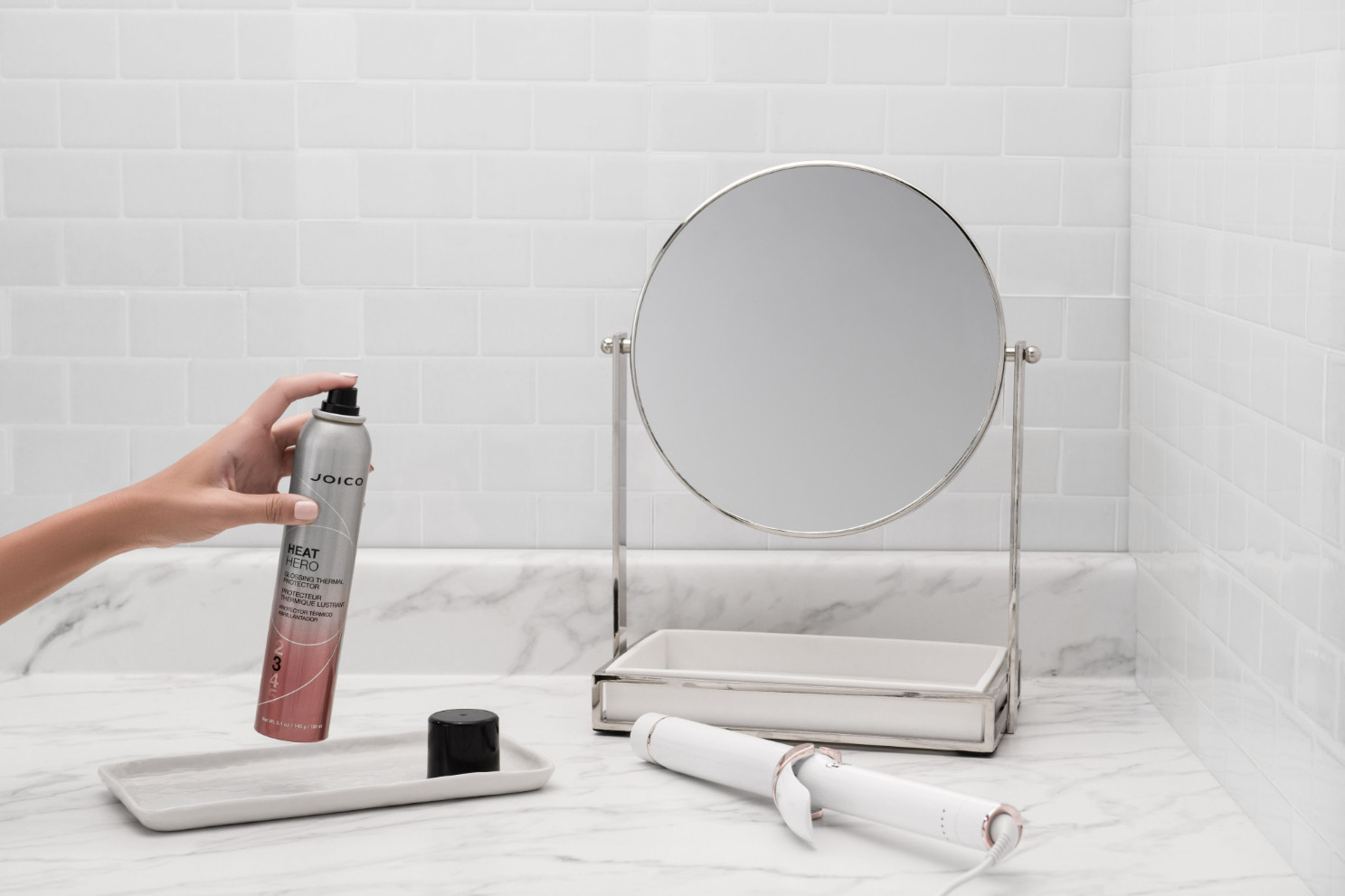 heat hero spray in hand near sink