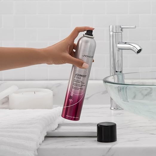 joimist firm product in hand near sink