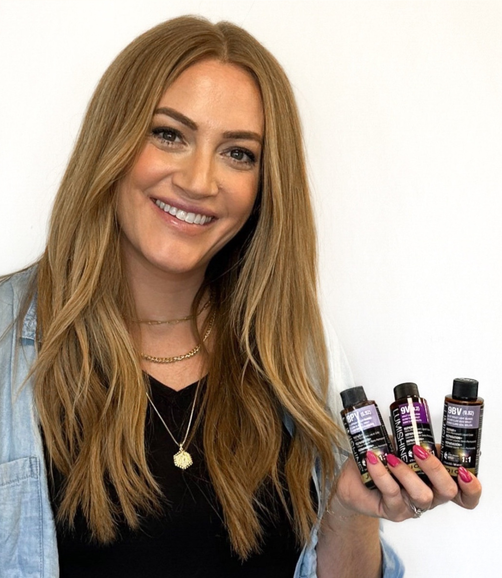 melissa holding lumishine bottles