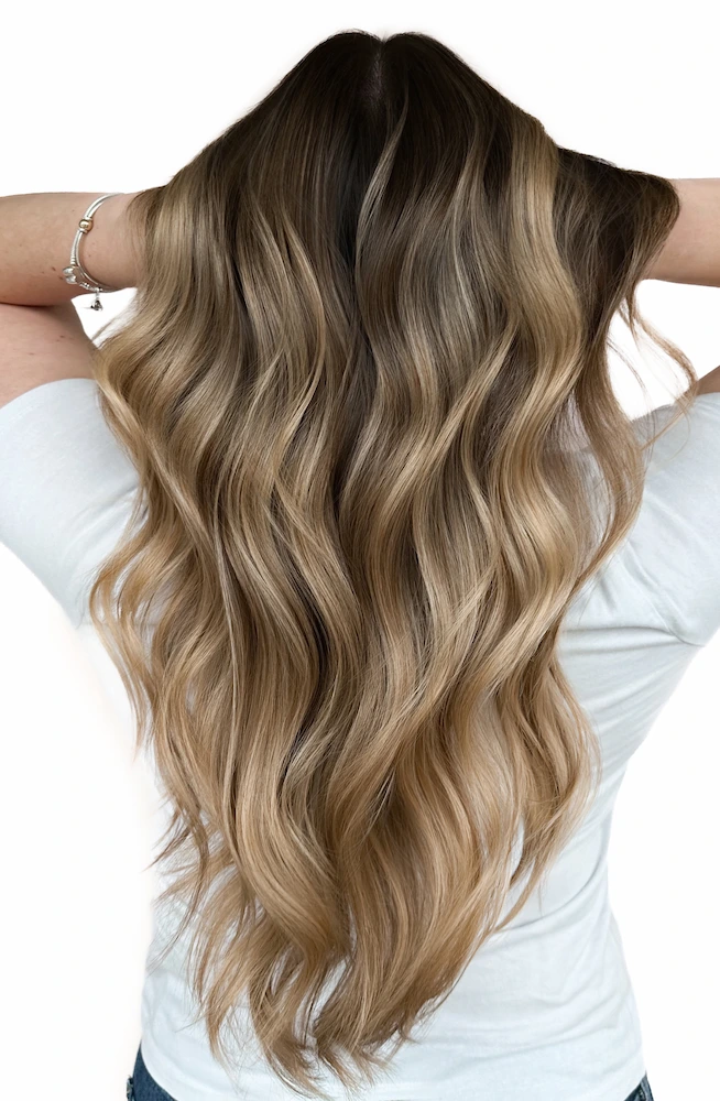 Melissa Maloney with showing off hair with capri champagne blonde hair color